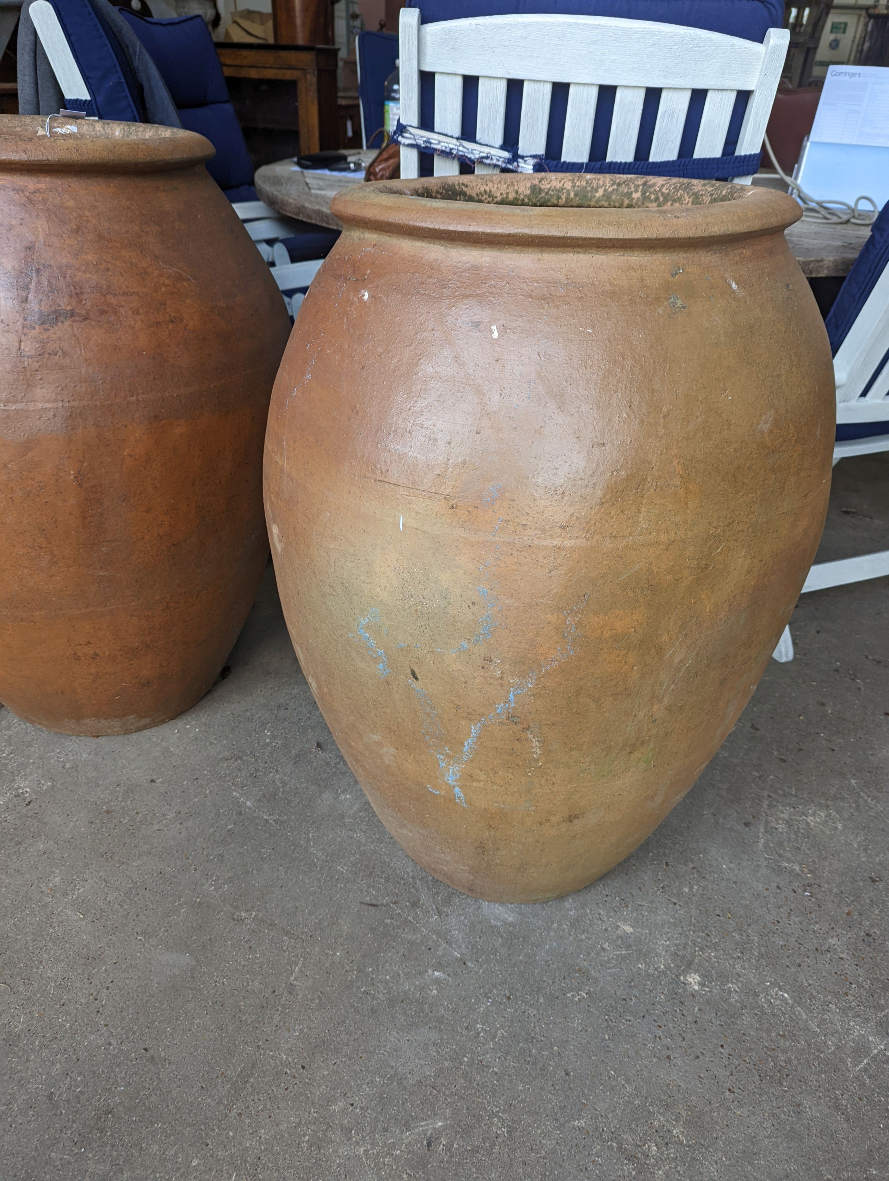 A pair of large terracotta garden planters, height 88cm